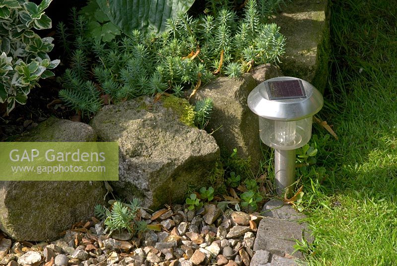 Solar powered garden light by stone and gravel edged border - 'Trevinia', Stubbins, Lancashire, NGS