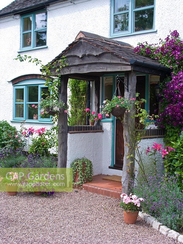 Front porch with hanging baskets and Clematis - Lilac Cottage, Staffordshire, NGS