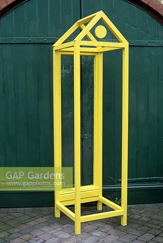 Step by step of making a vertical greenhouse made from discarded window frames
