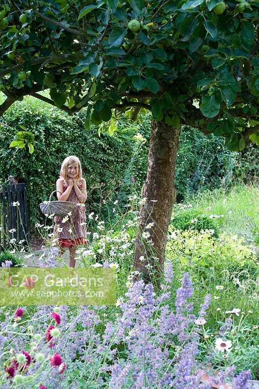 Young girl in summer garden