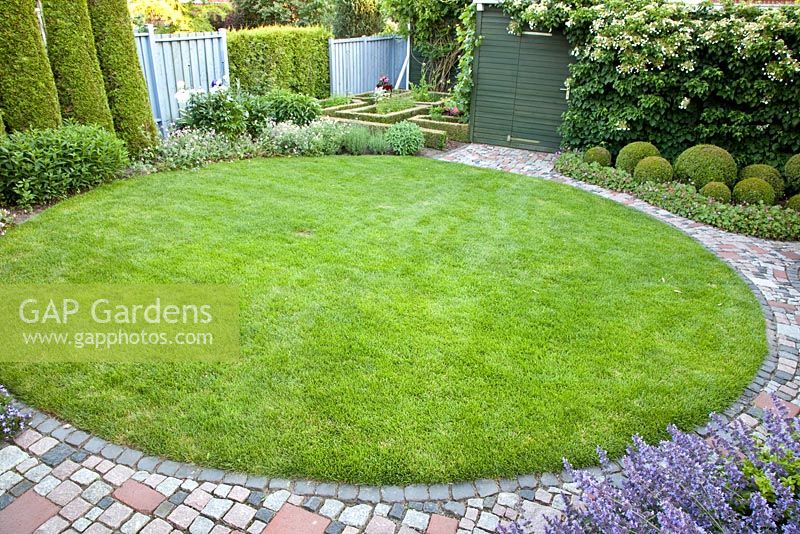 Circular lawn in suburban garden