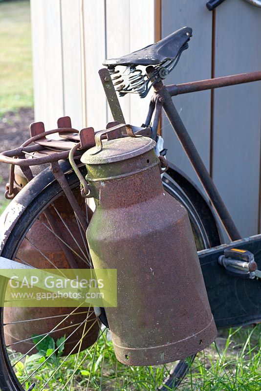 Old bicycle with milk churns 