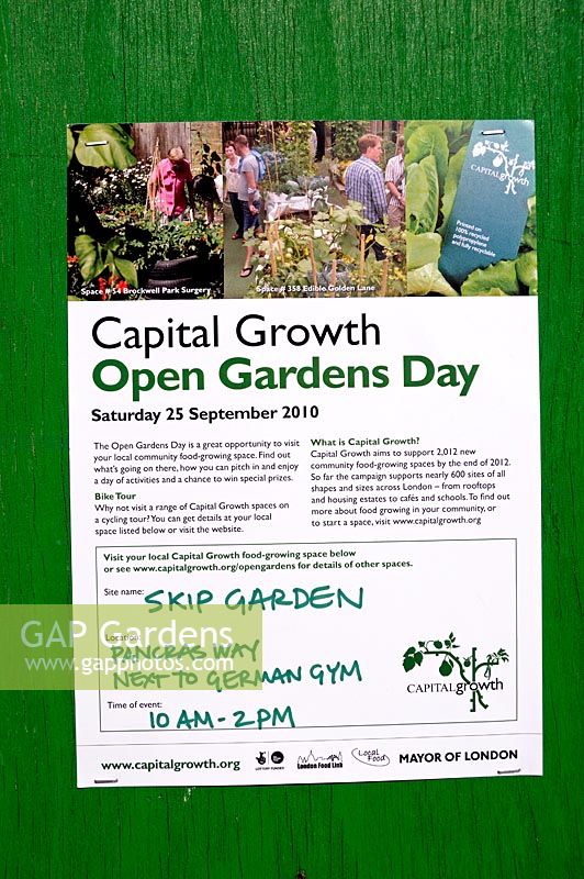 Poster, pined to an old green door, advertising Capital Growth Open Garden Day at the Srik Garden Kings Cross London UK