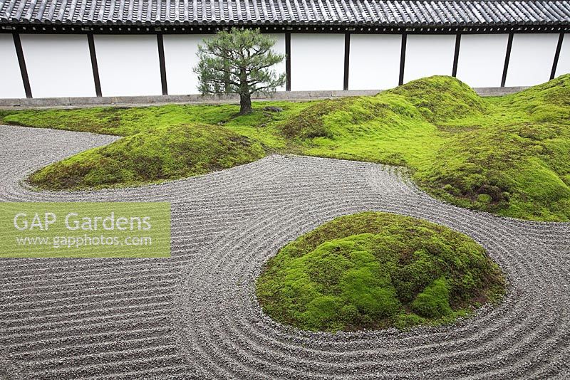 A karesansui garden, showing five moss covered sacred mountains placed on the sand garden-floor 'Hakkai', meaning the eight rough seas, designed by Mirei Shigemori in 1939 - Tofuku-ji, Kyoto, Japan 