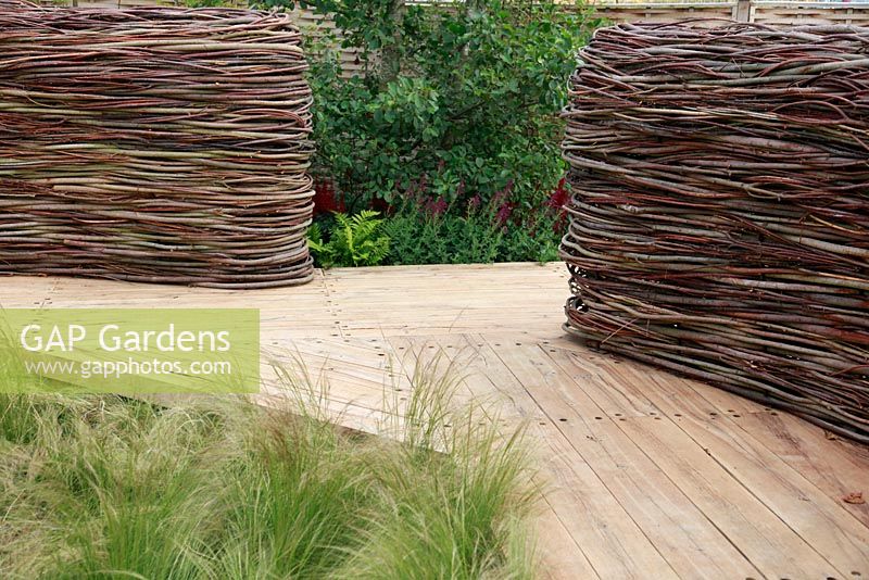 'NEST' woven from pliable willow and dogwood, made of feather grass, Stipa tenuissima - The Future Gardens, St Albans, Herts

