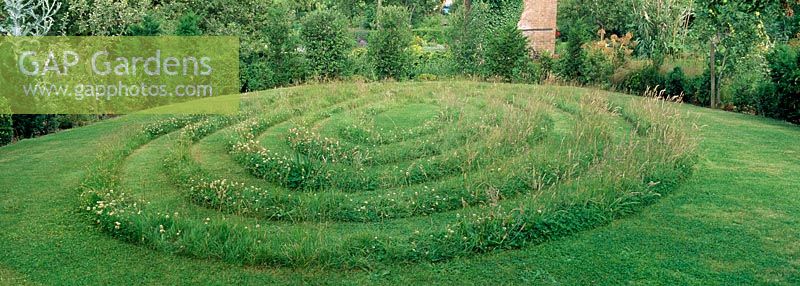 A grass maze on a hillside designed by Stella Carr at Hill Close Gardens. Warwick