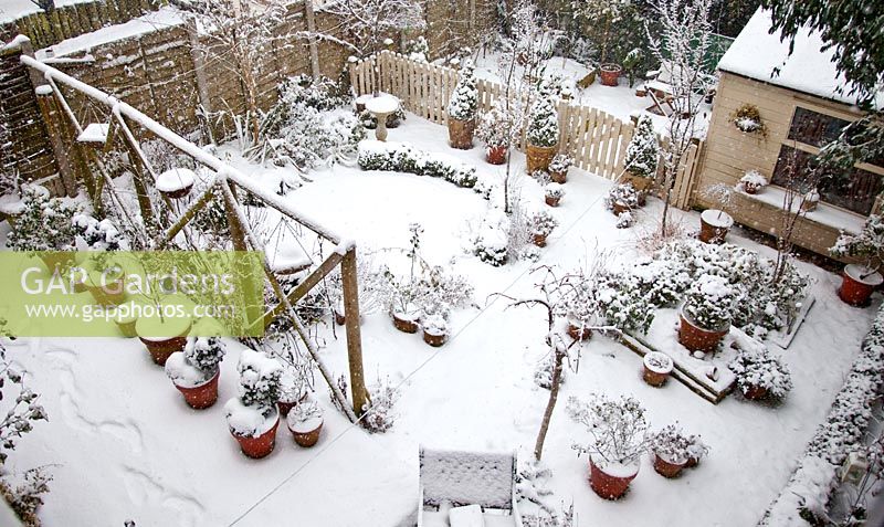 Heavy snow fall on cottage garden, High Meadow , Cannock Wood, UK 