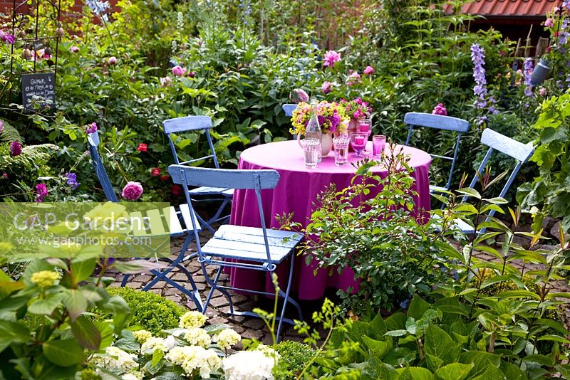 Dining area with blue and pink theme surrounded by colourful borders