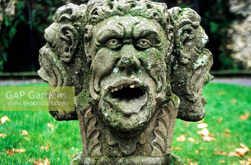 Carved stone faces at entrance of Fontana del Deluvio, Villa Lante, Viterbo, Italy