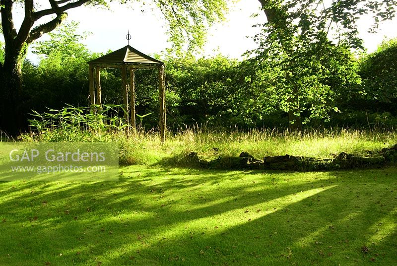 Gazebo below tall beeches beside the stone circle lawn - Pinsla Garden, Cardinham, Cornwall