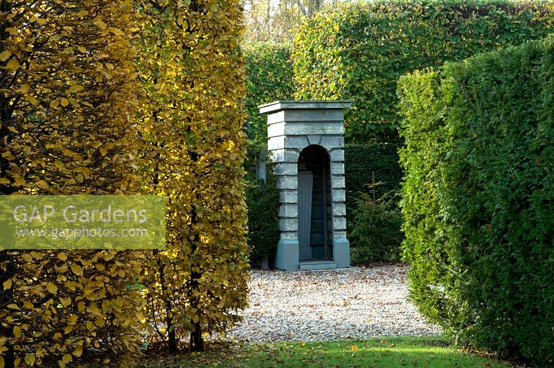 Sentry box, gravel path and hedges of Taxus baccata and Fagus - Silverstone Farm, Norfolk