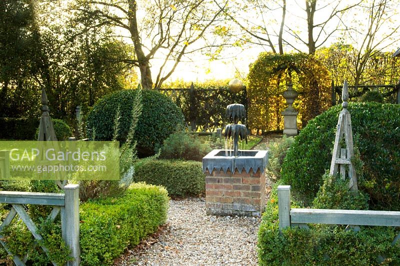 Buxus - Box parterre with water features and topiary. Silverstone Farm, Norfolk, October