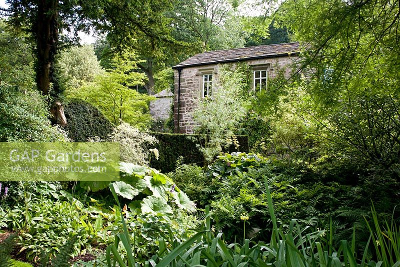 The Old Mill with shady border at Gresgarth Hall, Lancashire