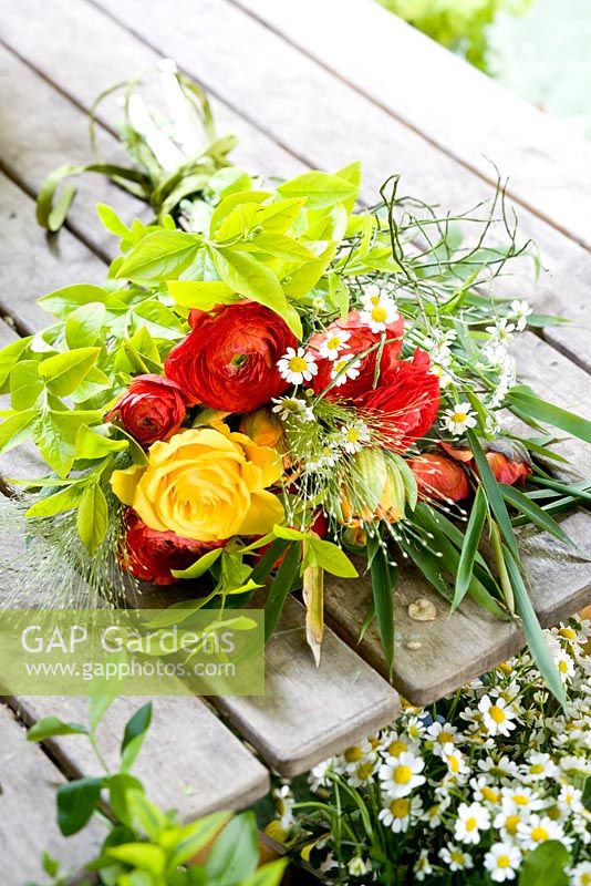 Bouquet with Ranunculus, Yellow Roses, Rynchospermum, Fennel, Dwarf Bamboo and stalks of grass