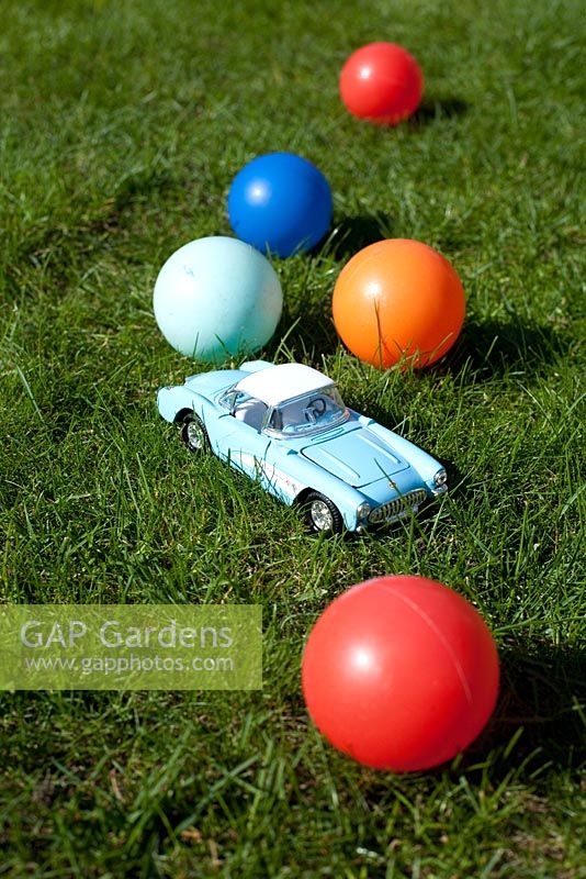 Toy car and brightly colours balls