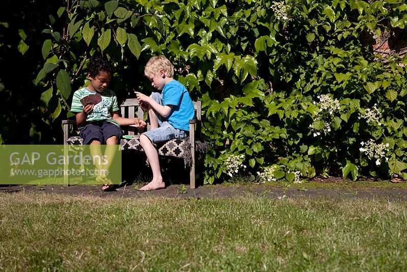 Children relaxing in the garden