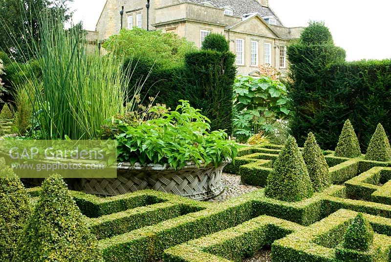 Basket pond at the centre of the Knot Garden came from the 1851 Great Exhibition. Bourton House, Bourton-on-the-Hill, Moreton-in-Marsh, Glos, UK
