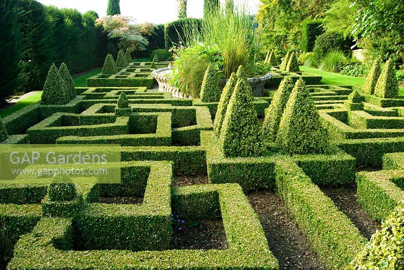 Knot Garden of clipped Buxus - Box with central basket pond from the Great Exhibition of 1851. Bourton House, Bourton-on-the-Hill, Moreton-in-Marsh, Glos, UK