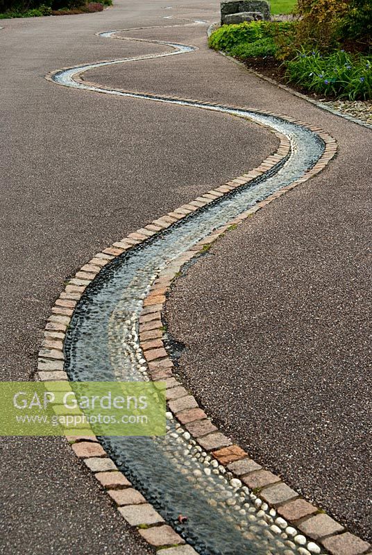 Pebbel lined rill. National Botanic Garden of Wales, Middleton Hall, Carmarthenshire, Wales, UK