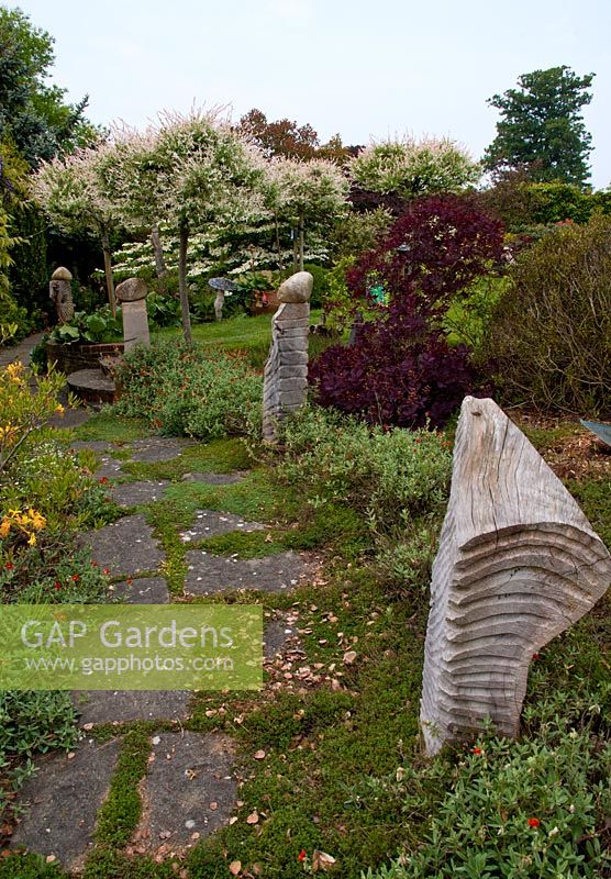 The Sculpture walk lining the Thyme path , Tilford Cottage, Surrey