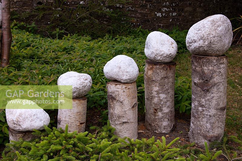 Garden sculpture using birch logs and stones - Tilford Cottage, Surrey