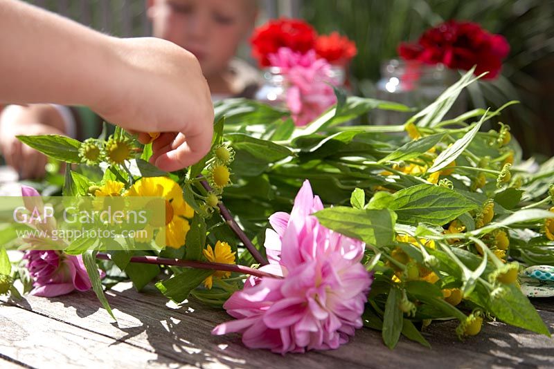 Children making summer bouquet