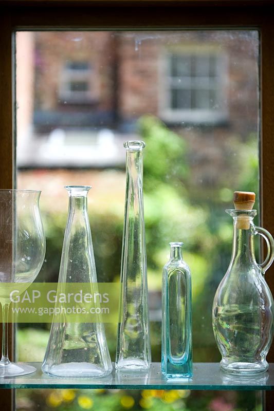 Glass bottles in the conservatory overlooking the garden - 17 Poplar Grove