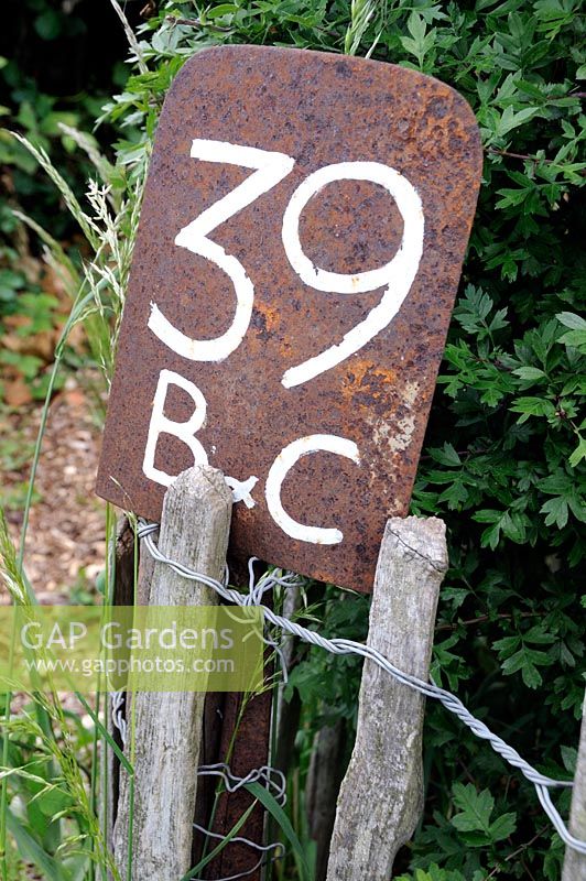 Rusty spade used as allotment plot marker for number 39