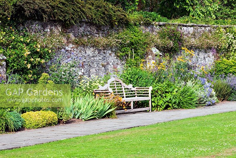 Dartington Hall, Devon. Historic Garden Grade II*. July. Dorothy Elmhirst's Sunny Border with Nepeta, Achillea, Hemerocallis, Agapanthus and Echinops