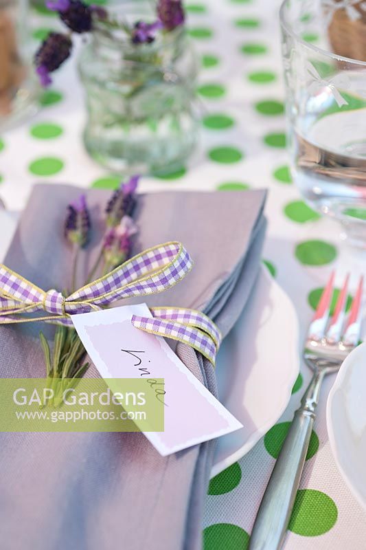Table laid for entertaining with name tags