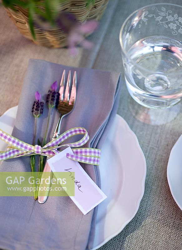 Table laid for entertaining with name tags
