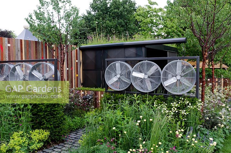 Wind turbines and steel-framed metal structure in the Stockton Drilling Winds of Change Garden, Gold Medal Winner - RHS Chelsea Flower Show 2011