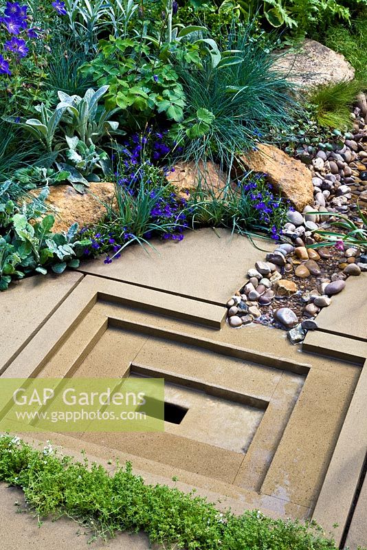 Decorative, York stone water drainage sump in 'The Art of Yorkshire garden', sponsored by Welcome to Yorkshire - RHS Chelsea Flower Show 2011

