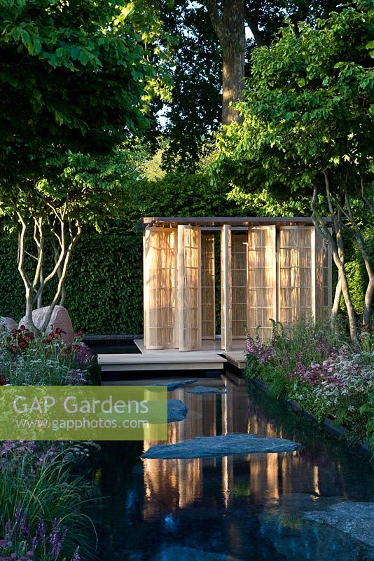 Japanese style pavilion next to pond in 'The Laurent-Perrier Garden by Luciano Giubbilei - Nature and Human Intervention' - Gold Medal Winner, RHS Chelsea Flower Show 2011
 