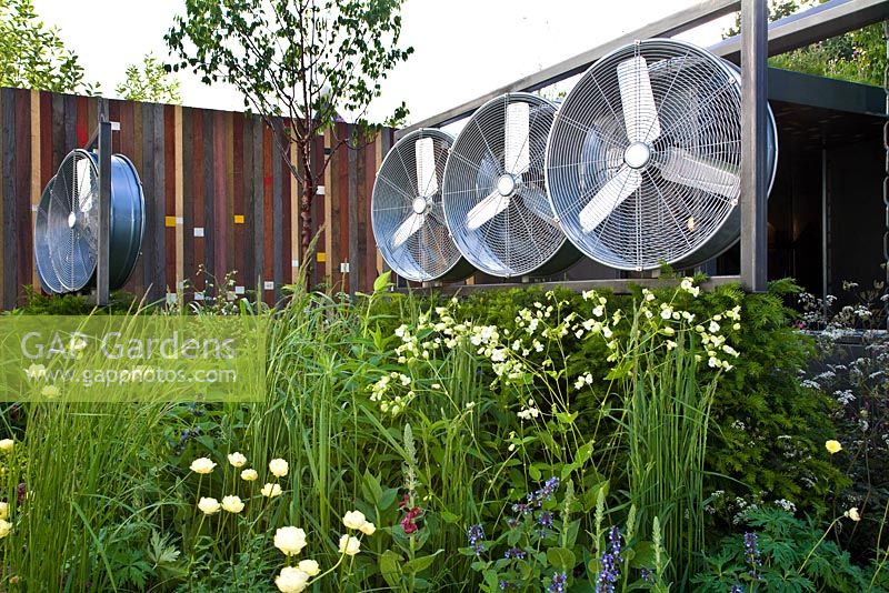 Wind turbines and steel-framed metal structure in the Stockton Drilling Winds of Change Garden, Gold Medal Winner - RHS Chelsea Flower Show 2011 