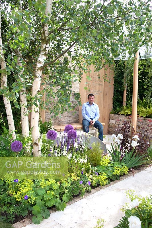 Paul Hervey Brookes sitting in the 'RNIB Garden' - Silver Gilt Medal Winner, RHS Chelsea Flower Show 2011