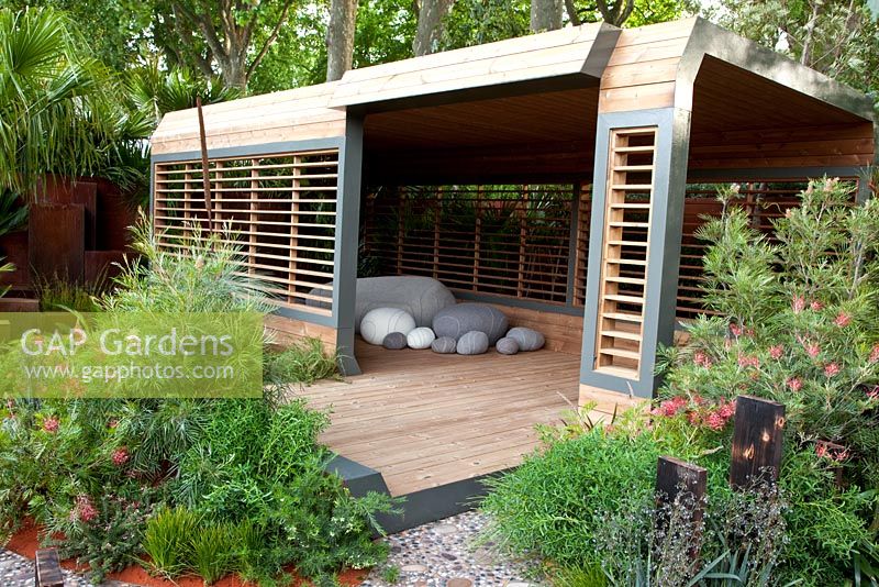 Contemporary wooden summerhouse and pebble shaped furniture in 'The Australian Garden presented by the Royal Botanic Gardens Melbourne' - Gold Medal Winner, RHS Chelsea Flower Show 2011 
