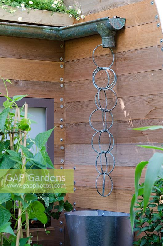 Feature water collector hanging from guttering - 'The Burgon and Ball 5 A Day Garden' - RHS Hampton Court Flower Show 2011