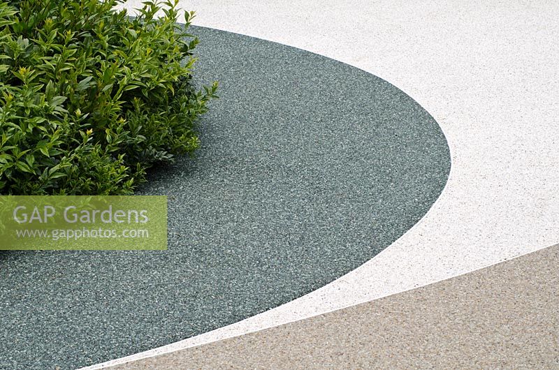 Permeable resin paving next to Sarcococca confusa - 'The Eye of the Internet Maze', Silver Medal Winner, RHS Hampton Court Flower Show 2011
 