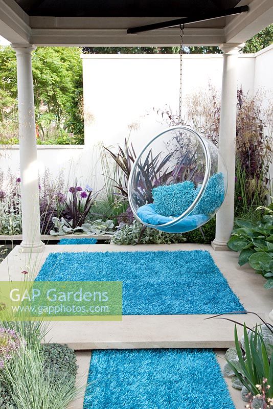Swing seat and colourful outdoor carpet. 'The Chilstone Garden', Silver medal winner, RHS Chelsea Flower Show 2011 

