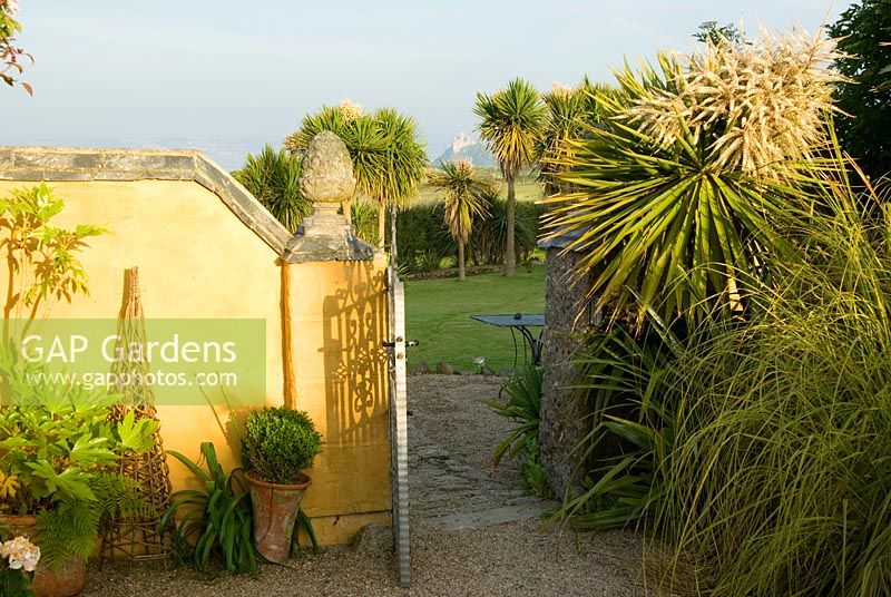 From the courtyard garden the gateway into the rest of the garden frames a view of St Michael's Mount
