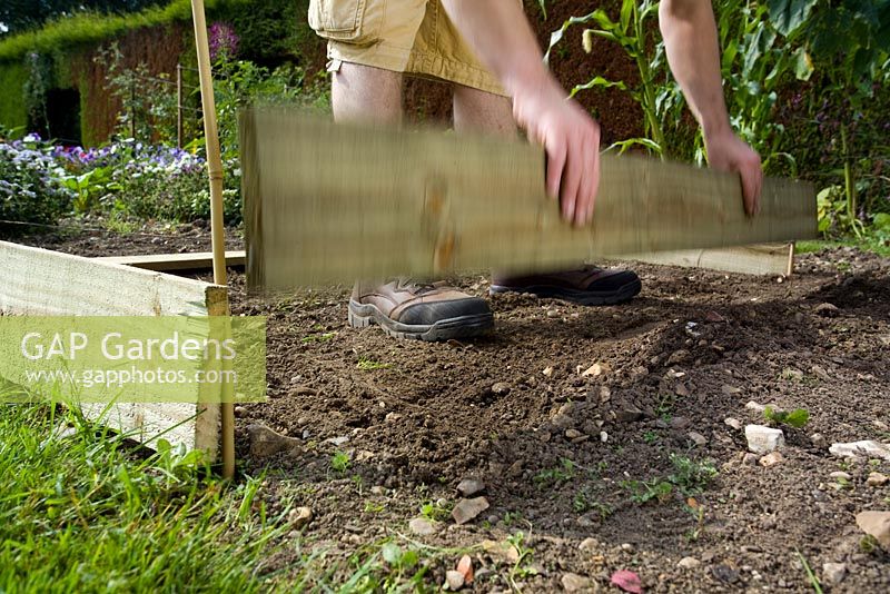step by step, making a raised bed - placing planks
