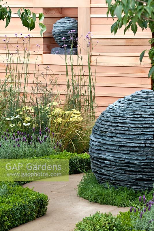 Modern garden with stone sculptures 