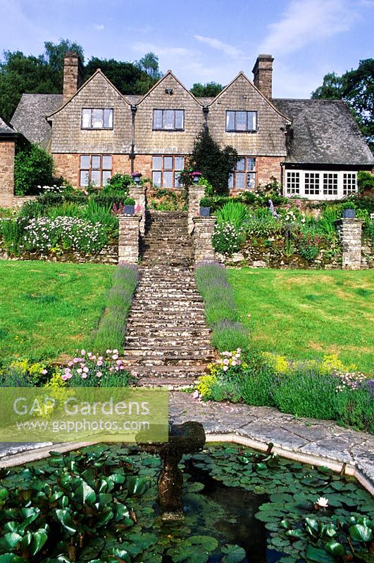 View to house and terraces from Octagonal Pool - High Glanau Manor, Monmouthshire, Wales 
