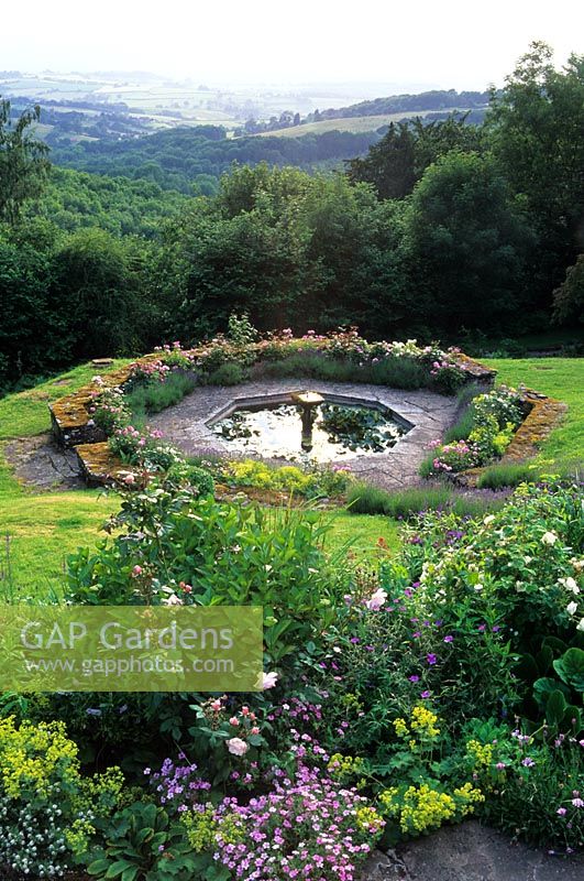 View from terrace to Octagonal pool and landscape beyond - High Glanau Manor, Monmouthshire, Wales 
 