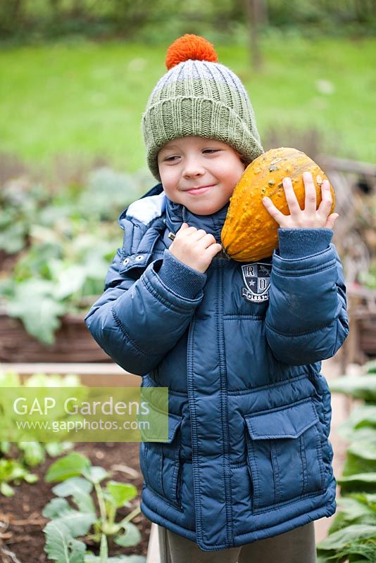 Boy holding Pumpkin