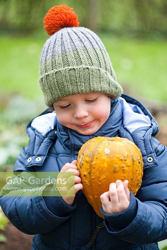 Boy holding Pumpkin