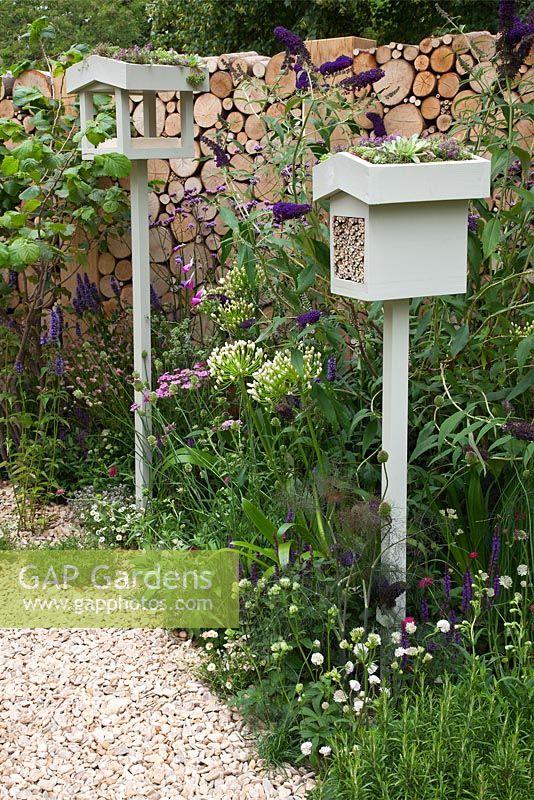 An insect box haven and a planting habitat to attract wildlife  - 'Wild in the City' garden - RHS Hampton Court Flower Show 2011
 