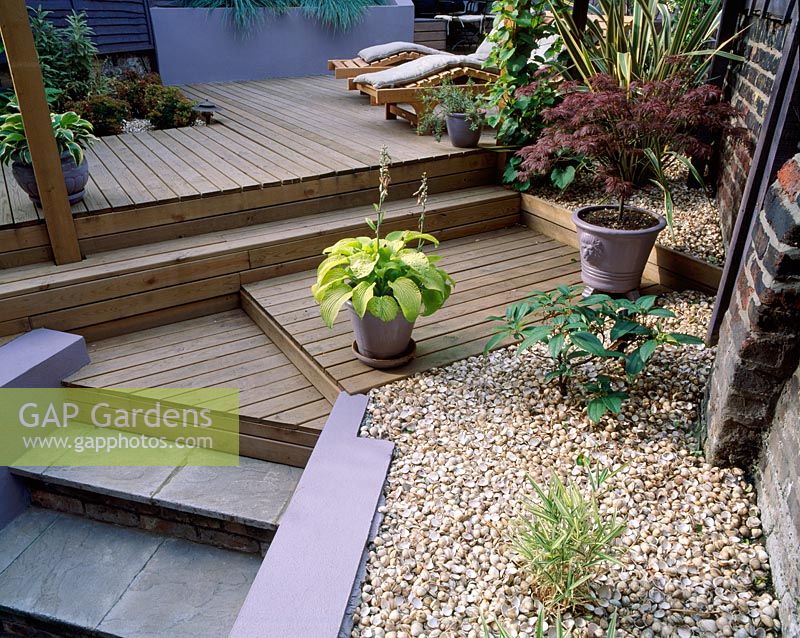 Split level garden with decking and garden furniture 