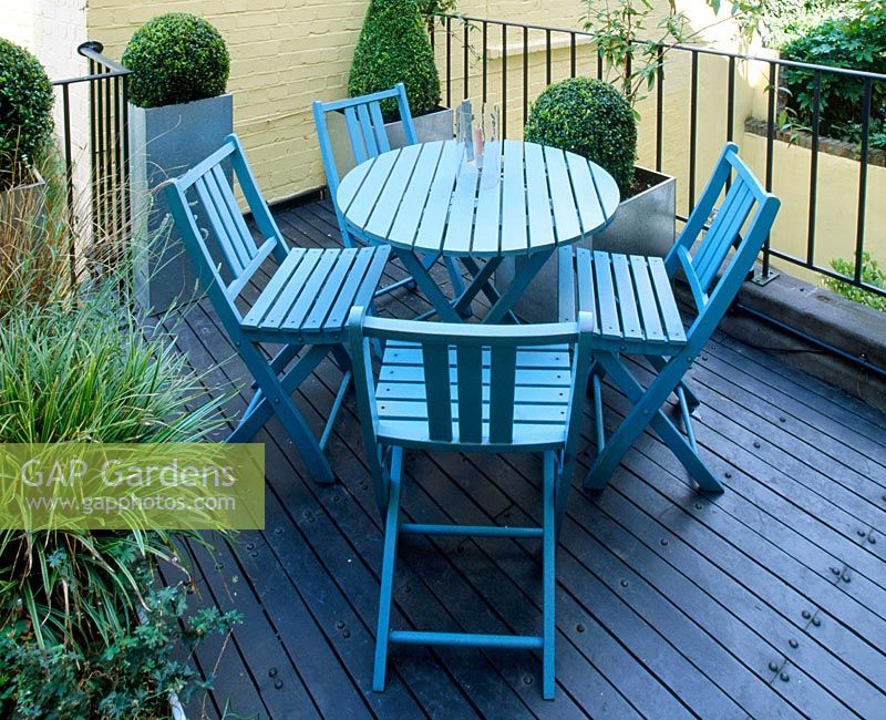 Roof garden with blue wooden furniture 
